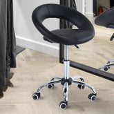 A sleek black leather office chair featuring wheels for easy movement, ideal for a modern workspace.